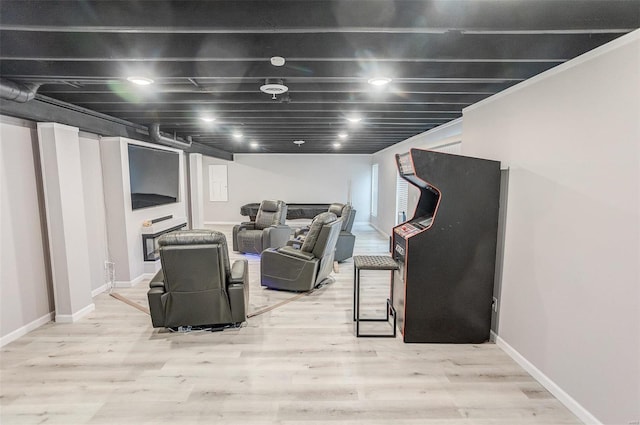 basement with light hardwood / wood-style floors