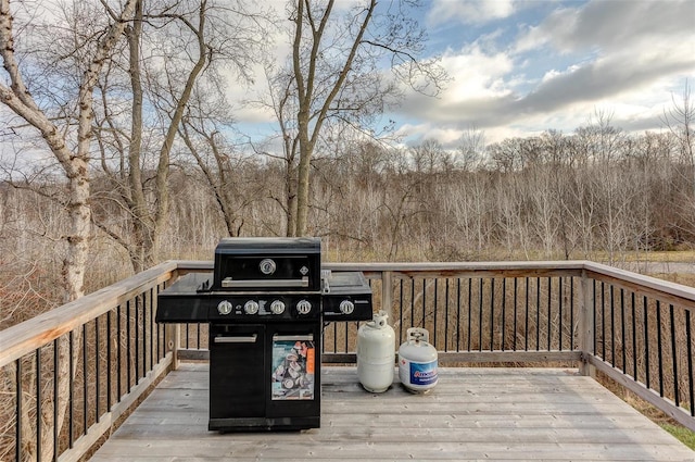 wooden terrace with a grill