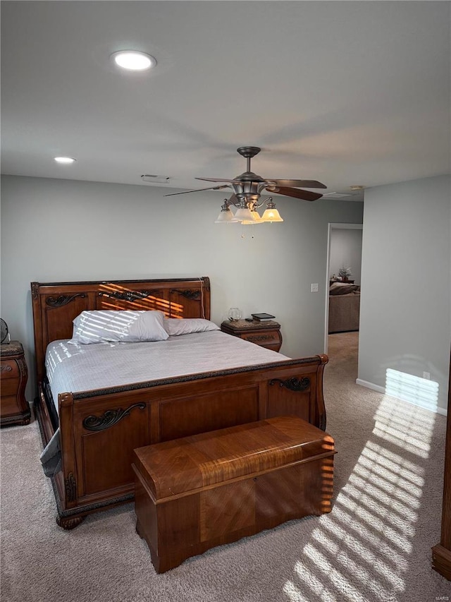 carpeted bedroom featuring ceiling fan