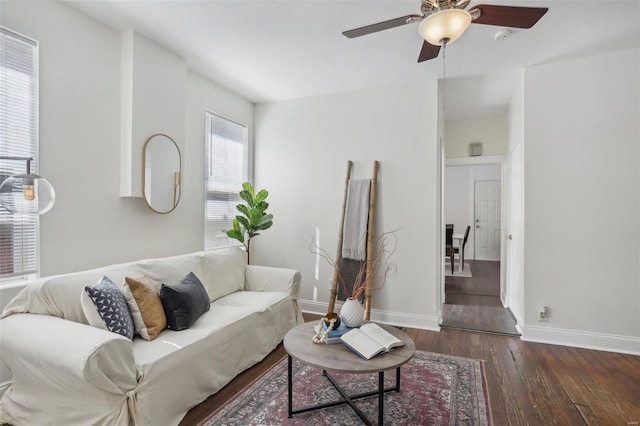 living room with dark hardwood / wood-style floors and ceiling fan