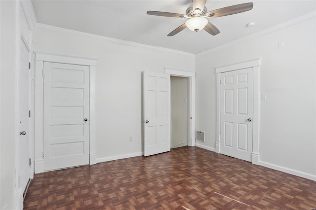 unfurnished bedroom featuring ceiling fan, dark parquet flooring, and crown molding