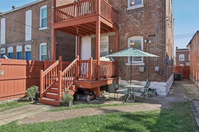 back of property with a patio