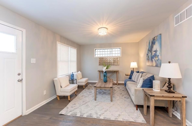 living room with dark hardwood / wood-style flooring