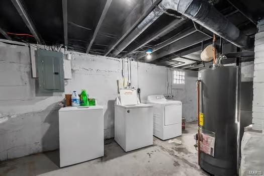 basement featuring independent washer and dryer, electric panel, gas water heater, and refrigerator