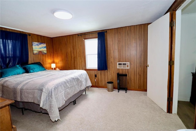 carpeted bedroom with wooden walls