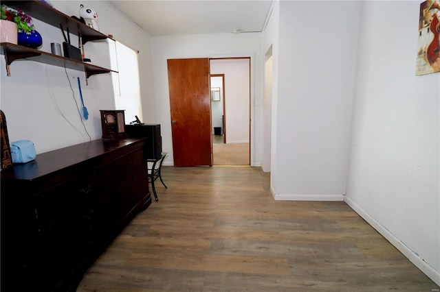 hall with dark wood-type flooring