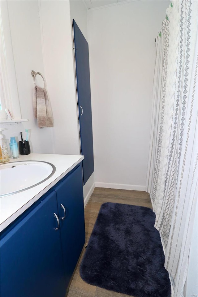 bathroom featuring vanity and wood-type flooring