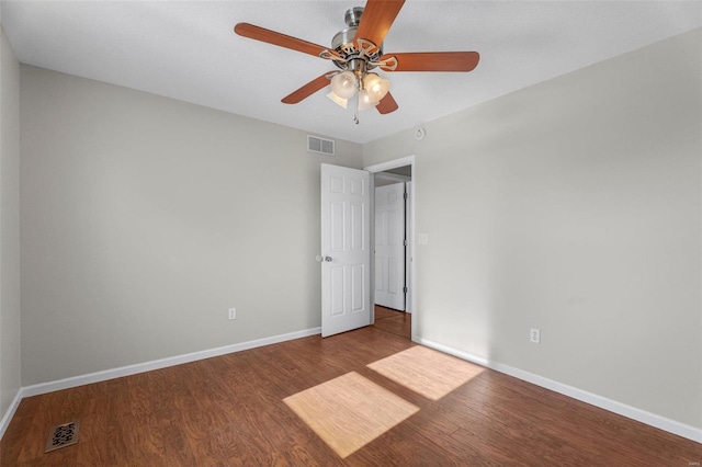 unfurnished room featuring hardwood / wood-style floors and ceiling fan