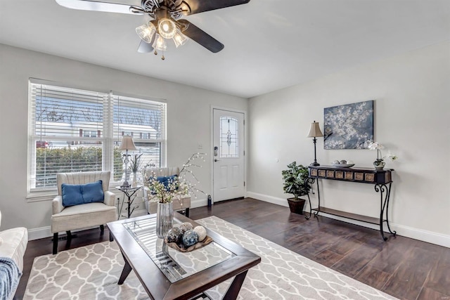 living room featuring dark hardwood / wood-style floors and ceiling fan