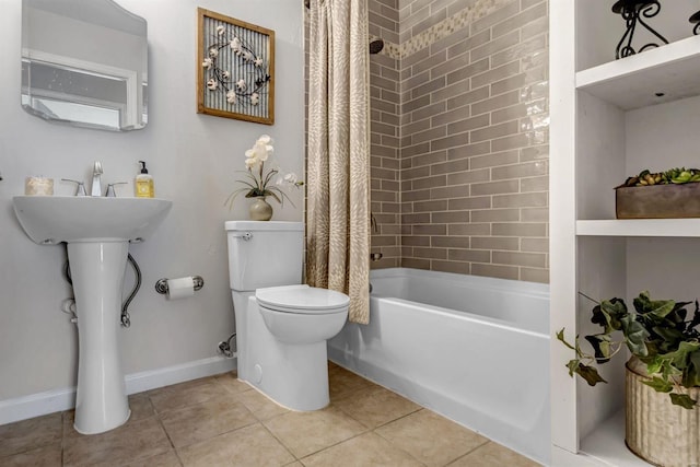 bathroom with tile patterned floors, shower / bath combination with curtain, and toilet