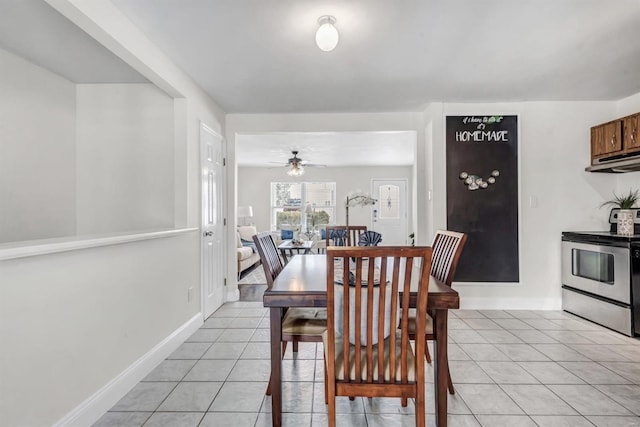 dining area featuring light tile patterned flooring and ceiling fan