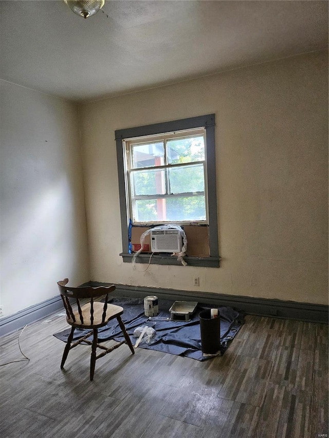 interior space with cooling unit and hardwood / wood-style floors