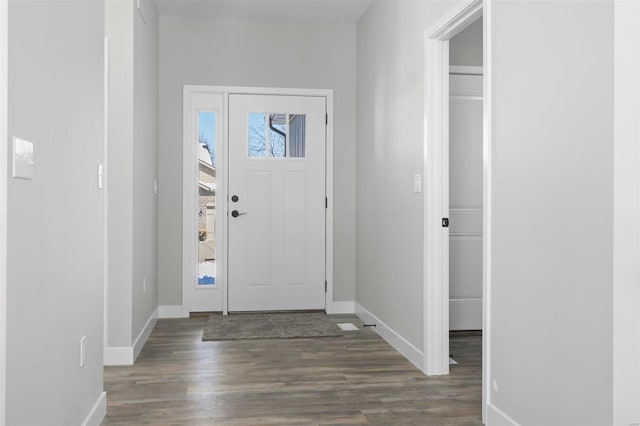 foyer entrance featuring dark hardwood / wood-style floors