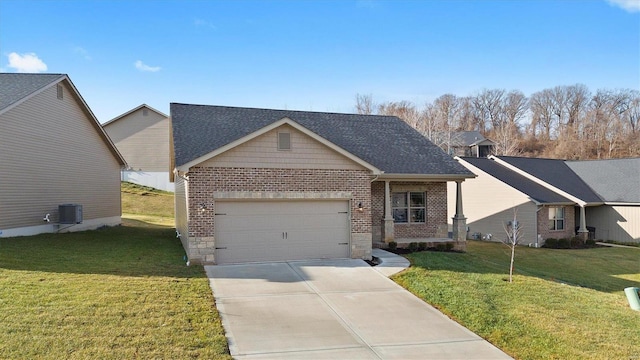 view of front of house featuring cooling unit, a garage, and a front yard