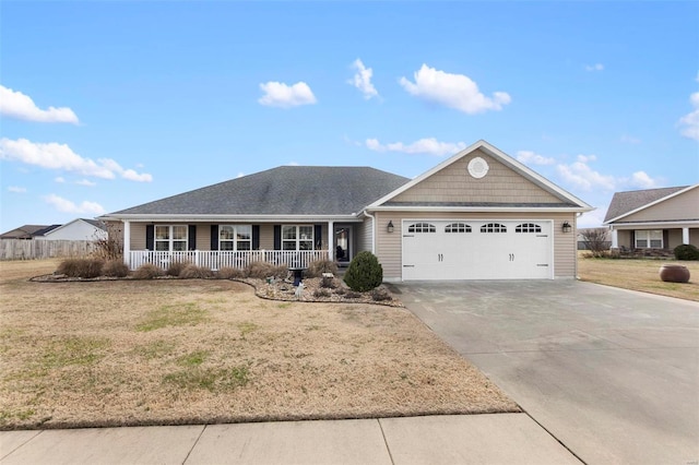 ranch-style home with a front yard, a garage, and a porch