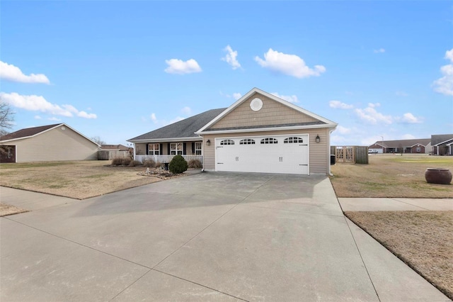 ranch-style home featuring a front yard, a garage, and a porch