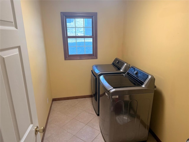 clothes washing area with washer and clothes dryer