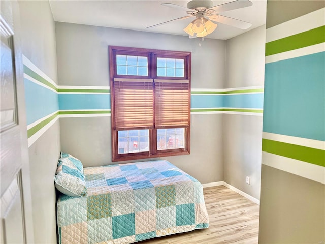 bedroom featuring ceiling fan and light hardwood / wood-style floors