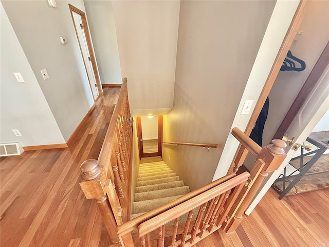 stairs with wood-type flooring