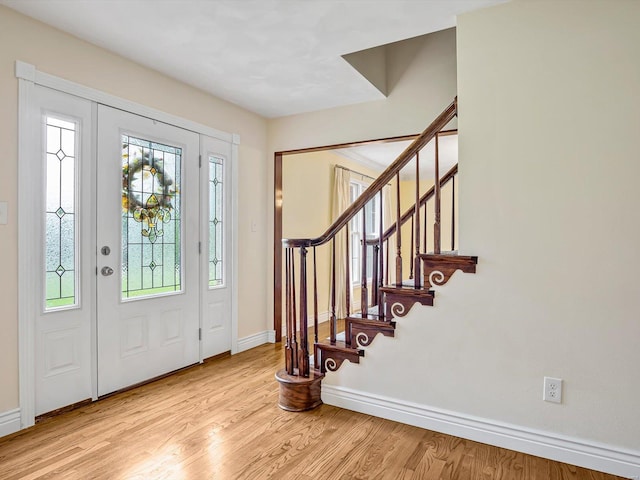 entryway with light hardwood / wood-style flooring