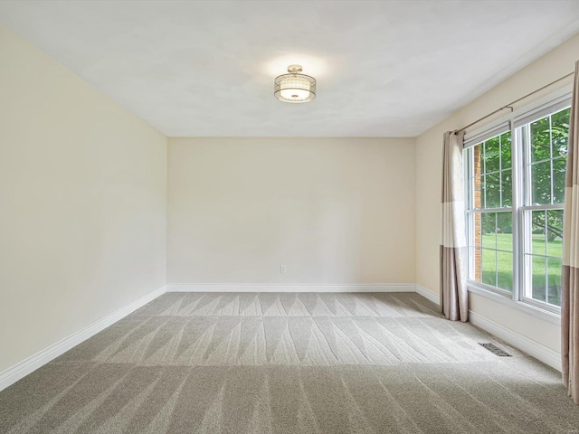 empty room with light colored carpet