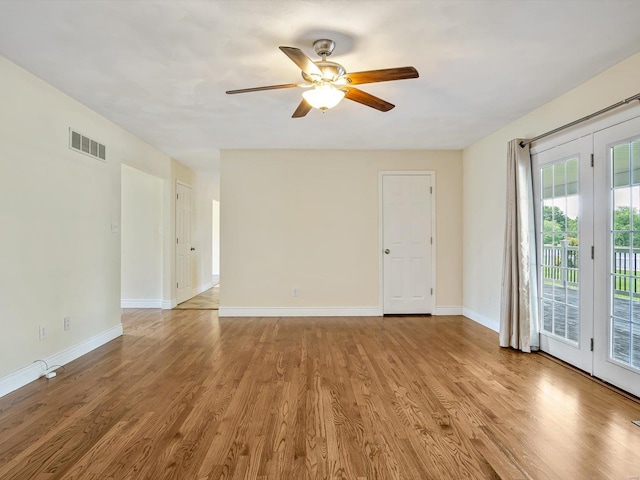 spare room featuring light hardwood / wood-style floors and ceiling fan