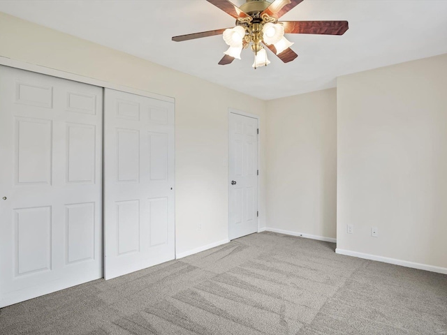 unfurnished bedroom featuring ceiling fan and light carpet