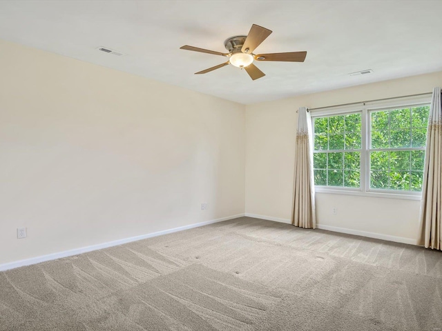 carpeted empty room with ceiling fan