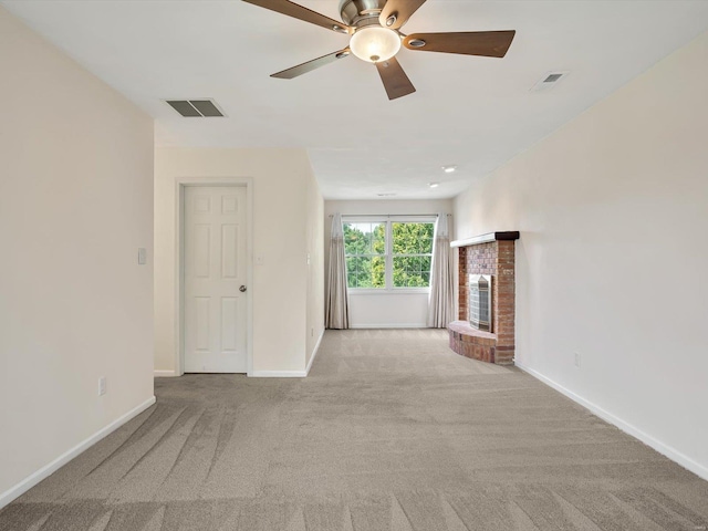 unfurnished living room featuring ceiling fan and light carpet