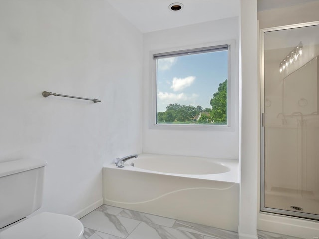 bathroom with toilet and separate shower and tub