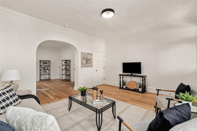 living room with ornamental molding and hardwood / wood-style flooring