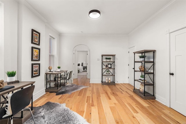 office with wood-type flooring and crown molding