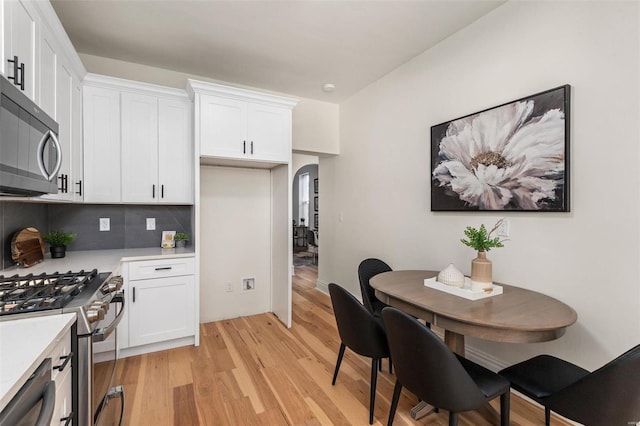 dining area with light hardwood / wood-style flooring