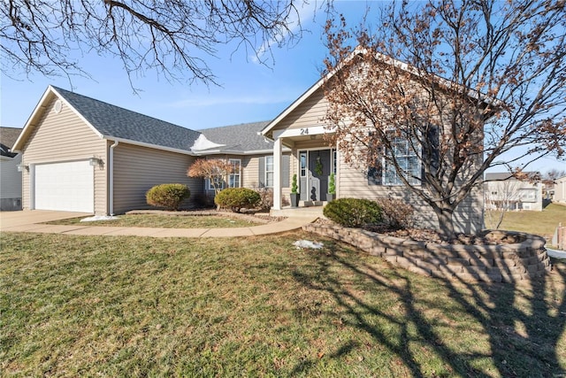 view of front facade featuring a garage and a front lawn