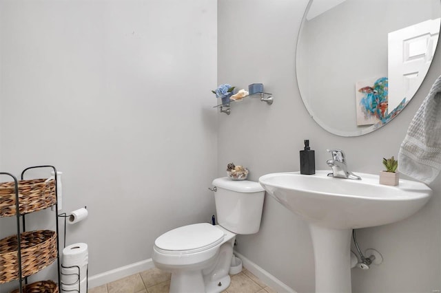 bathroom with tile patterned flooring and toilet