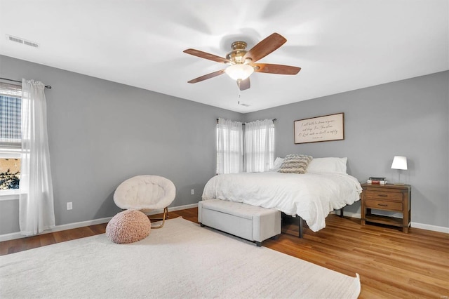 bedroom featuring hardwood / wood-style flooring and ceiling fan