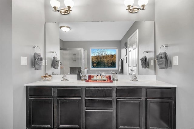 bathroom featuring vanity, a chandelier, and walk in shower