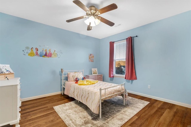 bedroom featuring dark hardwood / wood-style flooring and ceiling fan