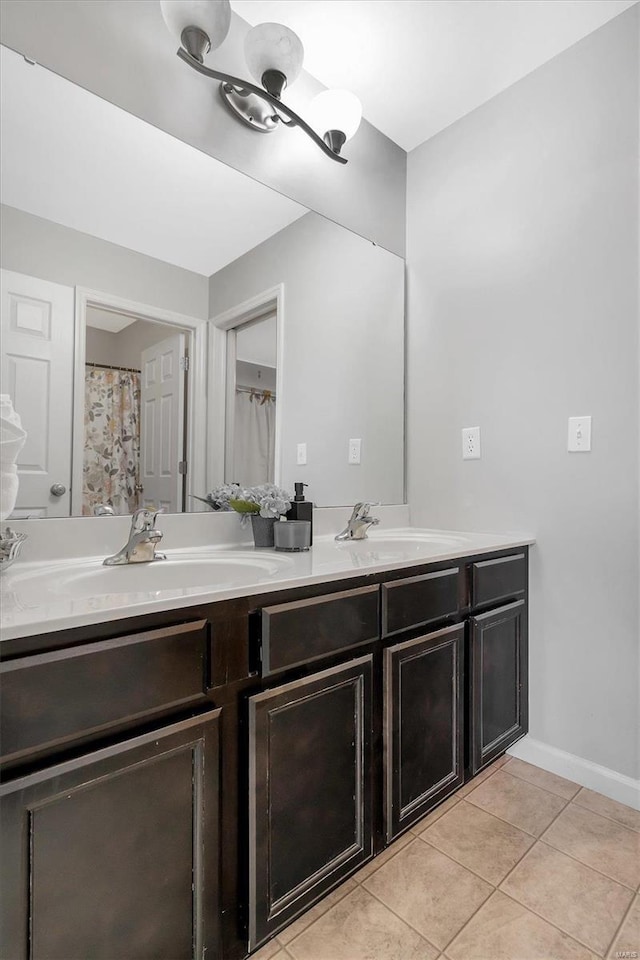 bathroom featuring tile patterned floors and vanity