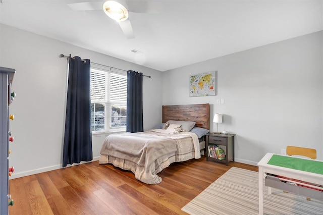 bedroom featuring ceiling fan and wood-type flooring