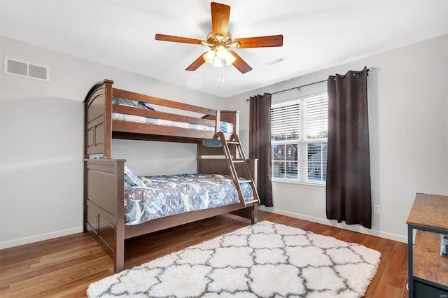 bedroom featuring hardwood / wood-style flooring and ceiling fan