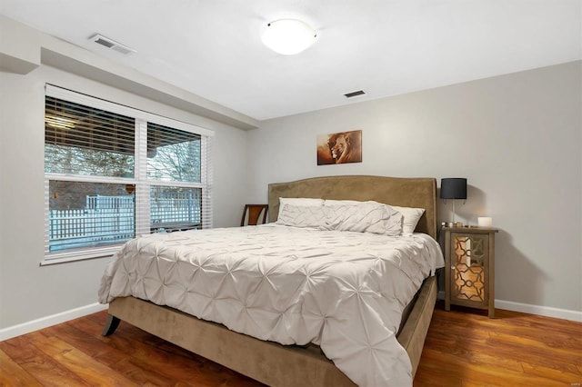 bedroom with hardwood / wood-style floors