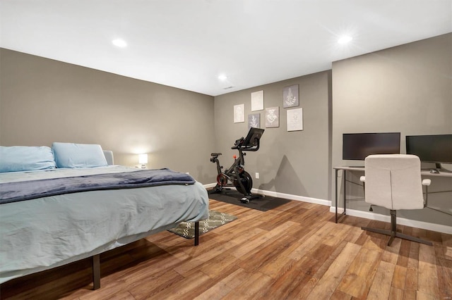 bedroom with wood-type flooring