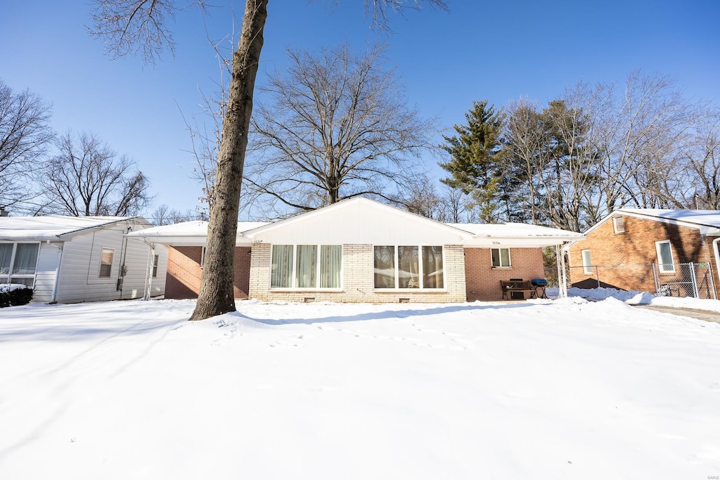 view of snow covered property