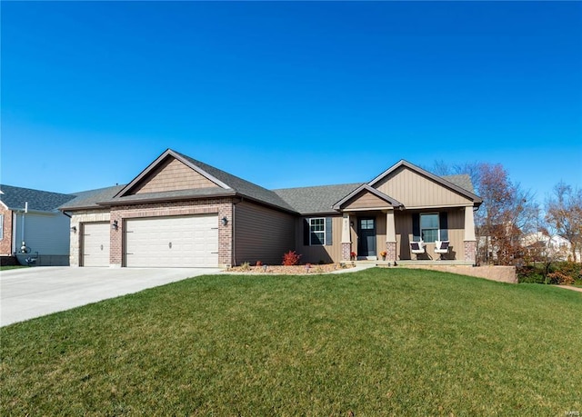 view of front of home featuring a front yard and a garage