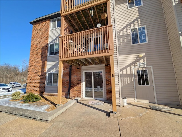 rear view of property with a balcony