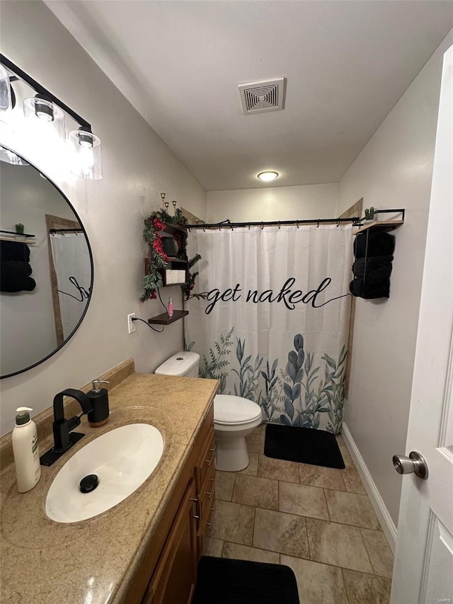 bathroom with toilet, vanity, and a shower with curtain