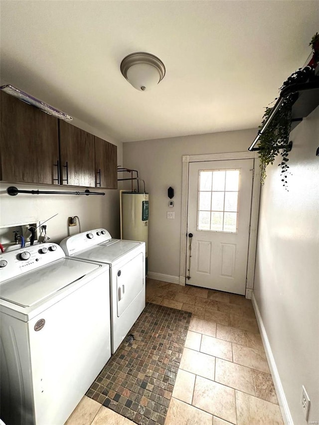 clothes washing area featuring cabinets, electric water heater, independent washer and dryer, and light tile patterned floors