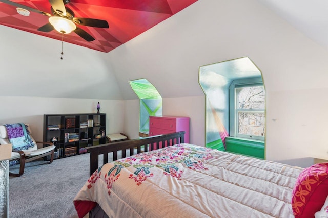 bedroom featuring lofted ceiling, carpet flooring, and a ceiling fan