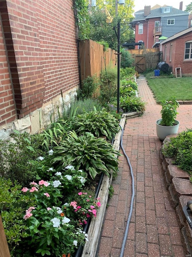 view of yard with a garden and fence